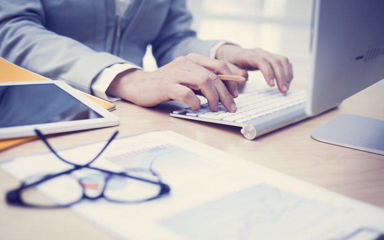 A man typing on keyboard